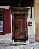 Carved wooden door frame of townhouse in Foix, Ariege, France