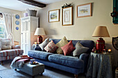 Blue sofa with striped armchair and lamps