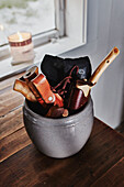 Detail of knives and tools in grey pot on kitchen worktop of Wooden cabin situated in the mountains of Sirdal, Norway