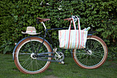 Bicycle with hat and shopping bag