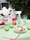 Crockery and tableware on a garden table on a summers day