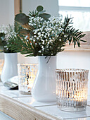 Lit tealights and cut flowers in Herefordshire cottage, England, UK