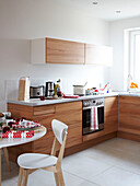 Christmas crackers on table in contemporary Polish kitchen