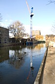 Industrial buildings near canal sunny day