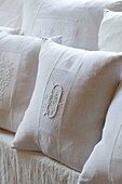 Close up of white pillow with embroidery