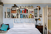 Wall mounted vintage shelving unit above bed Brighton, East Sussex UK