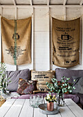 Coffee sacks and sofa with flowers on table in studio shed Guildford Surrey