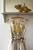 Alternative christmas tree idea dress hanging from mirror decorated with christmas baubles