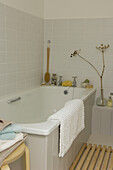 Tiled bathroom with wild flower display