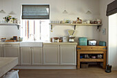Sunlit kitchen in Canterbury home England UK