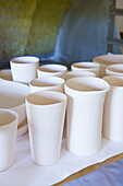 Ceramic cups on shelf in work studio, Austerlitz, Columbia County, New York, United States