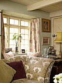 Sofas and window detail in living room of Welsh cottage, UK