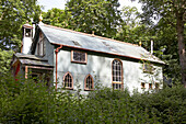 Corrugated metal exterior of woodland chapel in Shropshire, England, UK