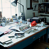 Untidy desk in a home office study