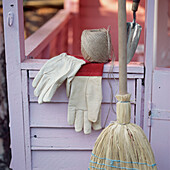 Purple painted garden shed with gardening tools
