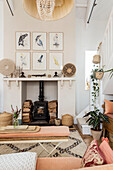 Woodburner and Japanese prints in living room of Devon cottage