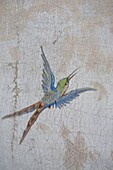 Hand-painted bird in flight on exterior wall, Majorca, Spain