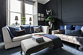 Dark panelling and blue hues in drawing room of Victorian terrace Wandsworth London Uk