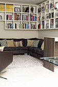 Brown corner sofa with corner shelving for books