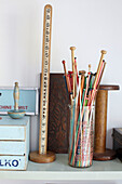 Knitting needles and sewing equipment on shelf in Ryde workroom Isle of Wight, UK