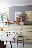 Framed artworks and craft equipment with fabrics in Ryde work studio Isle of Wight, UK