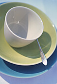 Close up of a fifties style crockery with silver plated teaspoon