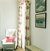 Armchair and floral curtains