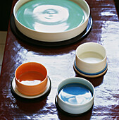 Colourful ceramic home ware on a coffee table