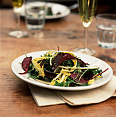 A plated spring leaf salad on a tabletop