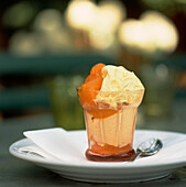 Plated dish of apricot and almond milk ice cream dessert