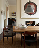 Open plan dining room with large table and views into the kitchen