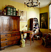 Yellow Living room with Vintage furniture and interesting collection of artworks and memorabilia