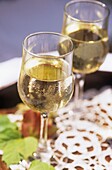 Close-up view of two glasses of white wine