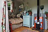 Single bed with quilt below window in Rye summer house, East Sussex, England, UK