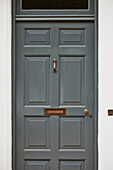 Panelled grey front door of Rye home, East Sussex, England, UK
