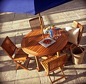 Wooden picnic table under sunshade