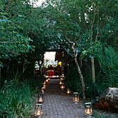 Line of lanterns leading path to outdoor living area