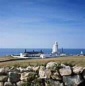Rural lighthouse and dry stone wall