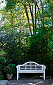 White bench in garden