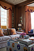 Orange curtains with pelmet in drawing room of Tiverton country home,  Devon,  England,  UK