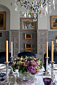 Cut rose centrepiece on dining table in Tiverton country home,  Devon,  England,  UK