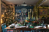 Dining table set for Christmas dinner in Benenden cottage,  Kent,  England,  UK