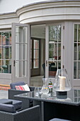 Garden furniture at exterior of contemporary Haywards Heath home,  West Sussex,  England,  UK