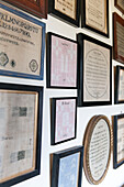 Framed antique texts in Ashford cottage  Kent  UK