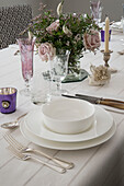 Place setting with pink roses in East Barsham cottage  Norfolk  England  UK