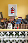 Hardbacked books and framed 3D artwork in Suffolk farmhouse  England  UK