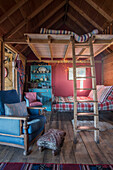 Mezzanine bed and ladder in summerhouse of Grade II listed cottage  Kent