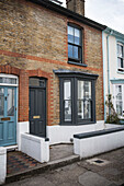 Grey paintwork on brick terraced house in Whitstable   Kent  England  UK