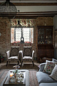 Pair of upholstered chairs and leaded window in Grade II Listed priory  Headcorn  Kent  UK