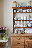 Assorted chinaware on kitchen dresser in Brighton home East Sussex England UK